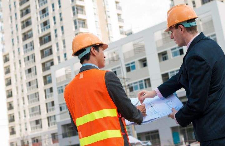 Architect and planner at construction site