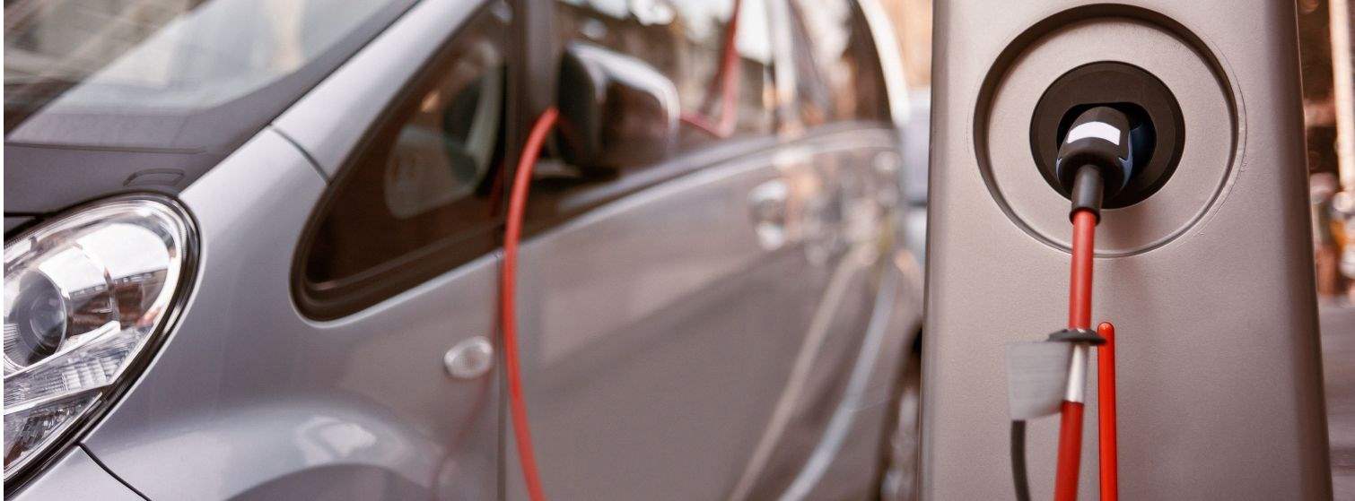 Electric car at charging point